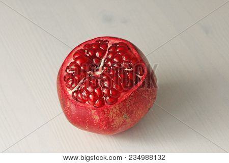 Big Ripe Red Granet Or Garnet. Fruits Of Red Ripe Pomegranate On The White Background. Vegetarian Co
