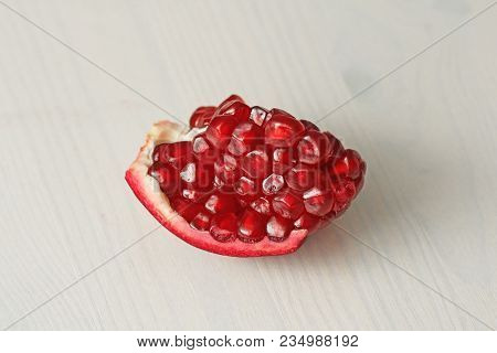 Big Ripe Red Granets Or Garnets. Fruits Of Red Ripe Pomegranate On The White Background. Vegetarian 