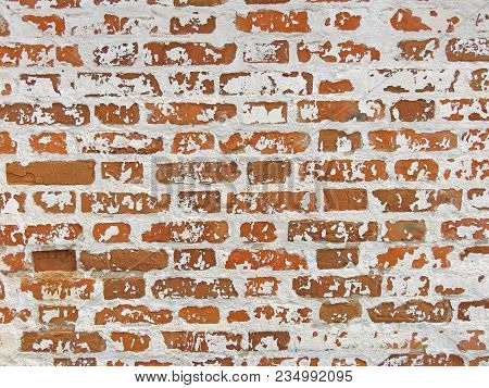 Old Wall Of Red Bricks And White Brayed And Cracked Old Paint. Red, Terracotta And White Brick Backg