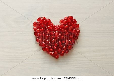 Red Heart Of Grenades. Big Ripe Red Granets Or Garnets. Fruits Of Red Ripe Pomegranate On The White 