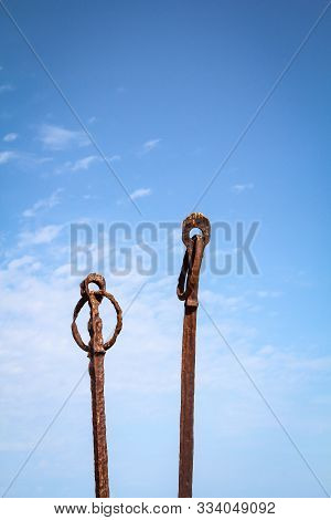 Mystical Rusty Rods With A Ring And Eyelet