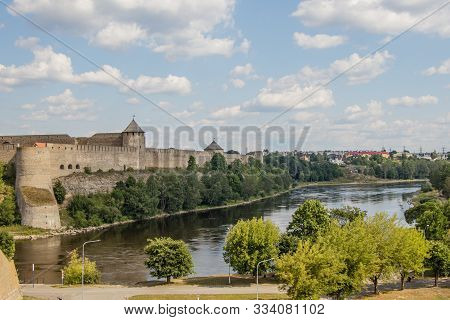 View Of The Fortress Wall Of The Russian Ivangorod Fortress And The Border River Narva From The Esto
