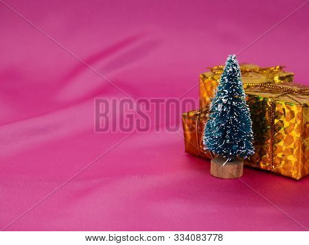 Christmas Tree On A Background Of Shiny Pink Satin As Background, Silk Background, Christmas Card. H