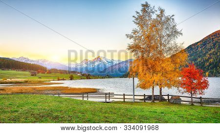 Splendid Autumn Panorama Of Haidersee (lago Della Muta) Lake With Ortler Peak On Background.
Locatio