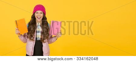 Public Library. Happy Child Hold Library Books Yellow Background. Little Girl Borrow Books In School
