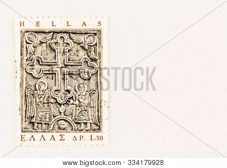 Seattle Washington - October 5, 2019: Bas-relief Stone Carving With Cross And Angels On Postage Stam