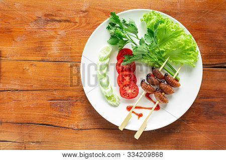 Fried Worm, Insect Food With Vegetable Salad In The White Bowl. Healthy Meal High Protein Diet Conce