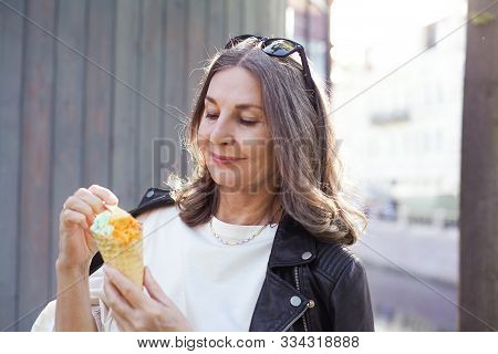 Cheerful Beautiful Mature European Female In Her Fifty Enjoying The Nice Summer Weather Outdoors, In