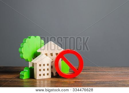 Residential Buildings Figurines And Red Prohibition Symbol No. Concept Of Inaccessibility, Lack Of H