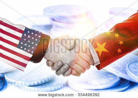 Print Screen Of Usa And China Flag On Shirts Of Businessman Hand Shaking.it Is Symbol Of Economic Ta