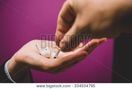 Paris, France - Oct 30, 2019: Woman Offering To Man To Share New Apple Computers Airpods Pro Headpho