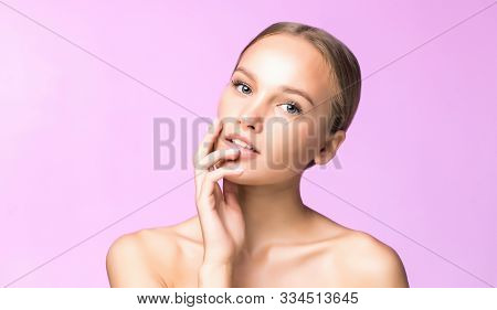 Woman Body Skin Care. Beautiful Young Female Touching Smooth Soft Skin On Pink Background. Spa And C