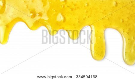 Flowing Yellow Slime On White Background. Antistress Toy