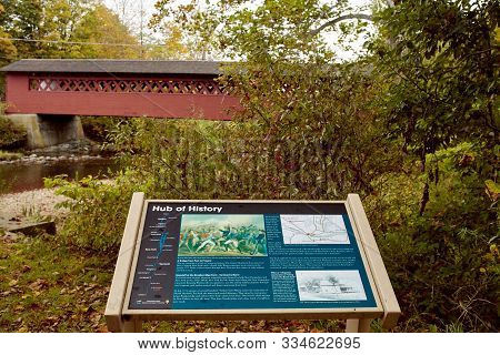 Bennington, Vermont - October 1st, 2019: Sign Overlooking Burt Henry Covered Bridge On A Cold, Fall 