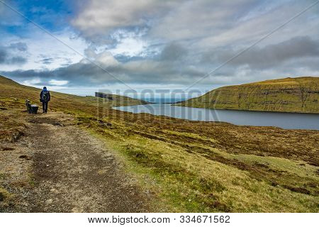 Unidentified Tourists Hikes In Sorvagsvatn Lake Over, Faroe Islands