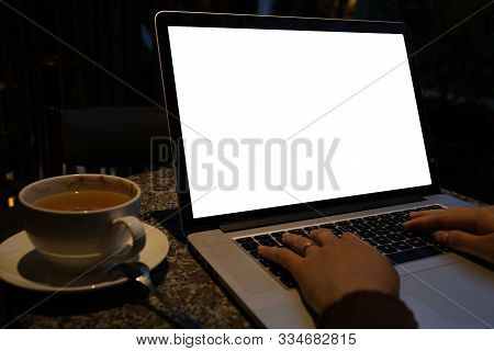 A Cup Of Cappuccino Coffee With Laptop White Screen On Table. Royalty High Quality Free Stock Photo 