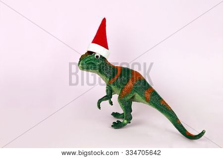 Funny Green Dinosaur Toy In Little Santa Claus Hat
