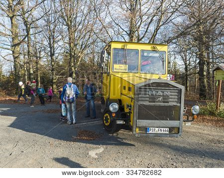 Germany, Sachsen, October 16, 2019: Old Retro Yellow Touristic Bus On Hochwald Hill Lookout With Gro