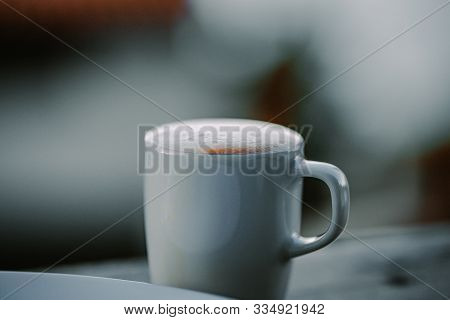 Coffee Cup With Espresso In The Morning For Breakfast On A Balcony With View Over The Coast Of The M