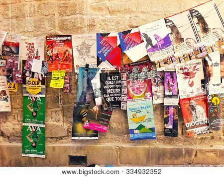 Avignon, France - 28 Juillet 2019: Plenty Of Playbills On A Wall During Famous Theatre Festival From