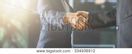Successful Negotiate And Handshake Concept, Two Businessman Shake Hand With Parthner To Celebration 