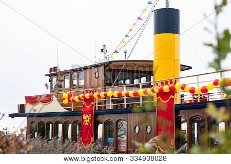 Traditional Steamboat Sailing On The Water With Festive Clothing And Package In Typical Dutch Sinter