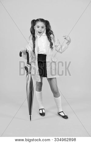 She A Fashion Victim. Cute Schoolchild Pointing Finger With Fashion Look On Yellow Background. Littl