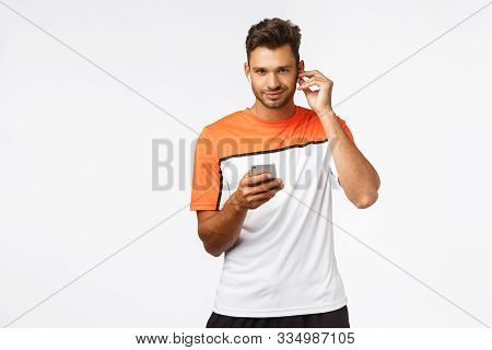 Guy Put On Motivational Music To Run Faster, Prepare For Maraphon. Sexy Handsome Sportsman In Active