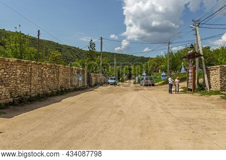 Butuceny, Republic Of Moldova -01 May 2016: View Of The Buildings And The Gravel Road In The Village
