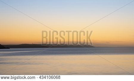 Beautiful Vibrant Late Summer Sunrise Over Pentewan Sands On English Cornwall Coast With Long Exposu