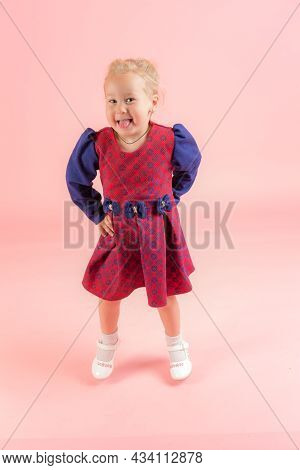 Portrait Of A Girl On A Pink Background