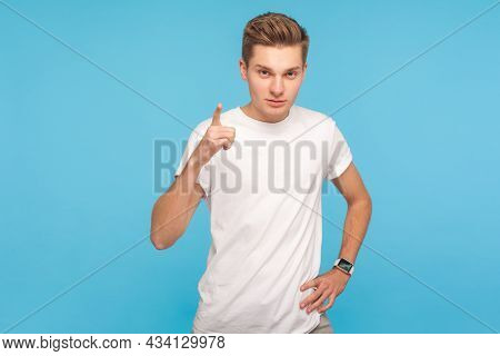 Be Careful, Im Warning You. Portrait Of Young Serious Man In T-shirt Standing With Admonishing Gestu