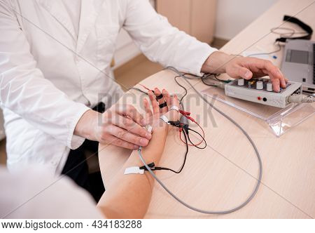 Patient Nerves Testing Using Electromyography At Medical Center