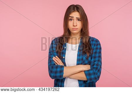 Portrait Of Displeased Unhappy Brunette Girl In Bad Mood Looking At Camera With Resentful Vexed Face