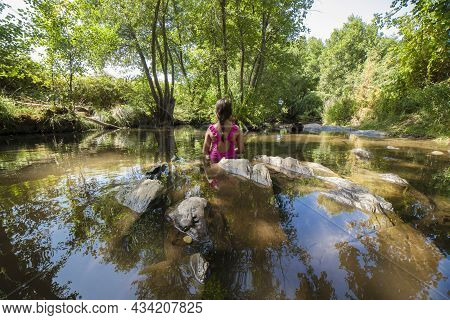Child Girl Discovering Gevora River, La Codosera, Badajoz, Extremadura, Spain. Idyllic Location Of C