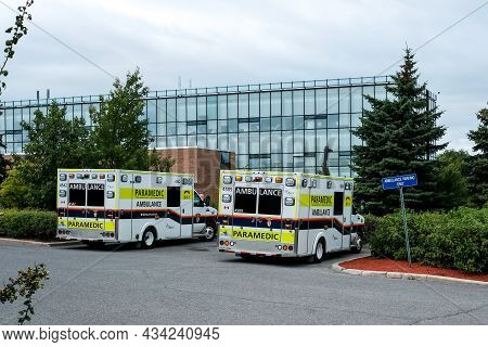 Ottawa, Ontario, Canada - September 2, 2021: Two Ambulances Are Parked Outside Of The Emergency Depa