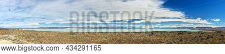 Wide panoramic photo of turquoise Viedma lake in Argentina 