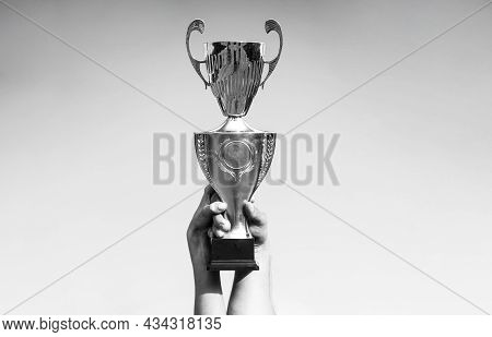 Winner, Win, Champions Cup, Prize. Winners Holding Champion Golden Trophies. Hand Of The Person With