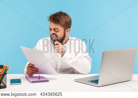 Serious Businessman Attentively Studying Analyzing Papers Holding Magnifying Glass, Looking For Mist