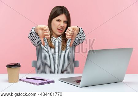 Displeased Woman Office Worker Showing Thumbs Down, Dislike Gesture, Expressing Disapproval, Critici