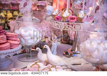 Delicious Desserts At The Wedding Candy Bar In The Buffet Area: Statuette, Figurine, Cake Pops, Mars