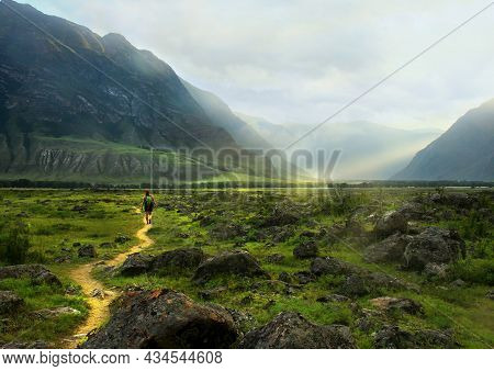 Summer Evening High In The Mountains, A Girl With A Backpack Walks Along A Path Among The Stones, Hi