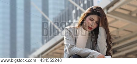 Lay Off. Sacked. Fired Business Woman Sitting On Stairs Of Office Building Outside.
