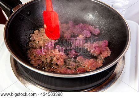 Preparation Of The Traditional Colombian Hogao Or Criollo Sauce (salsa Criolla) Made Of Onion, Tomat