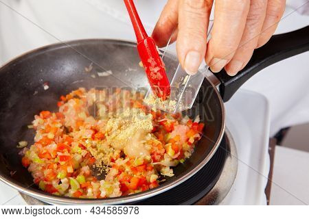 Preparation Of The Traditional Colombian Hogao Or Criollo Sauce (salsa Criolla) Made Of Onion, Tomat