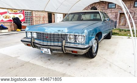 Side View Of A Blue Cadillac Eldorado Under The Canopy. Careful Storage Of A Vintage Car. Car Show O