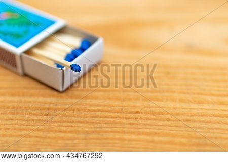 Matches In Box On Wooden Background. Closeup Shot. Matchsticks In Open Match-box Flat Lay.matches In