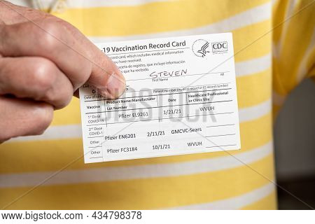 Morgantown, Wv - 1 October 2021: Covid-19 Vaccination Record Card Showing Three Doses Of Pfizer Vacc
