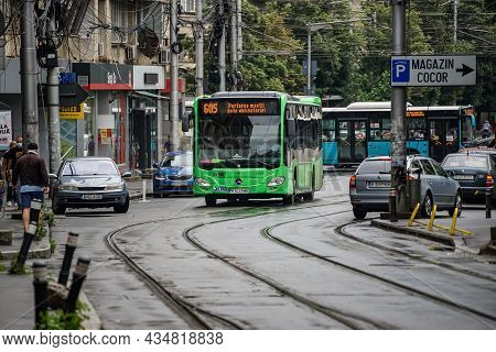 Bucharest, Romania - June 18, 2021: A Public Transport Bus Mercedes Citaro Hybrid Is Driven In Traff