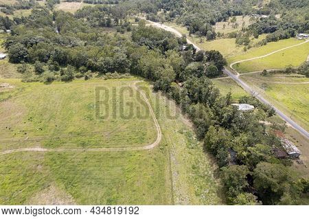 Aerial Landscape Over Fields, Bushland, Homes And Roads Leading Into A Well Known Valley Gorge, Finc